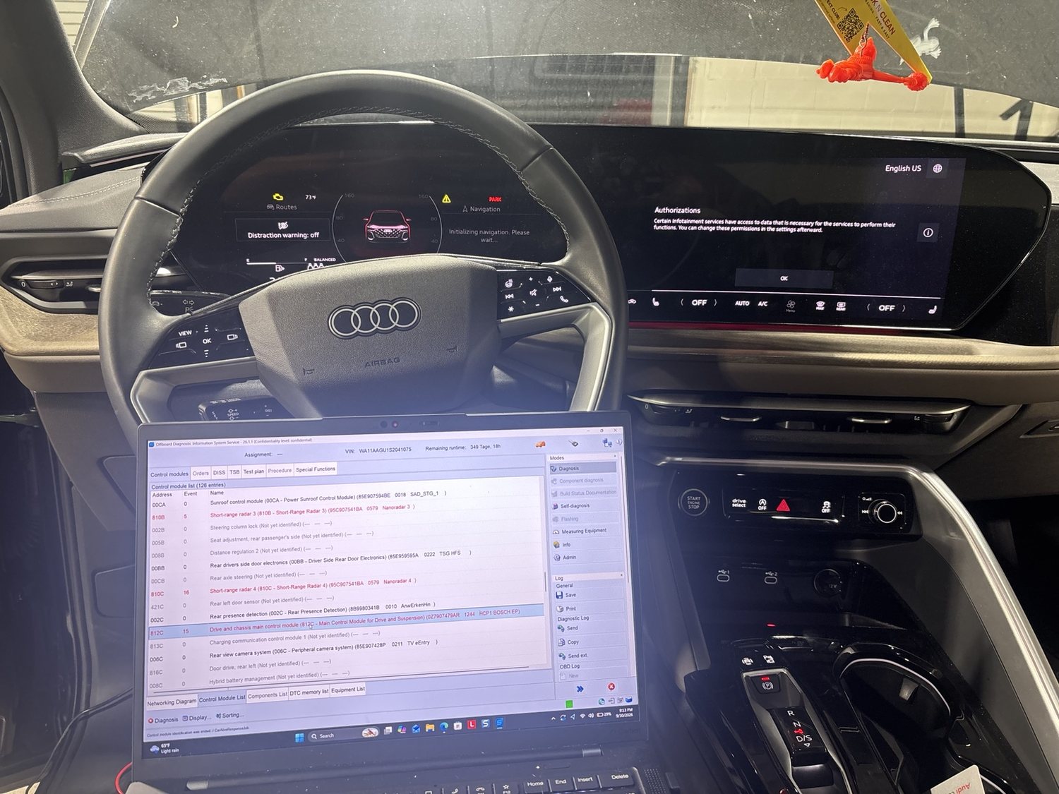 Modern Audi interior with OEM diagnostic software in use